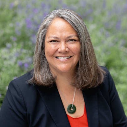Headshot of Hilary Statton, a smiley woman with gray hair