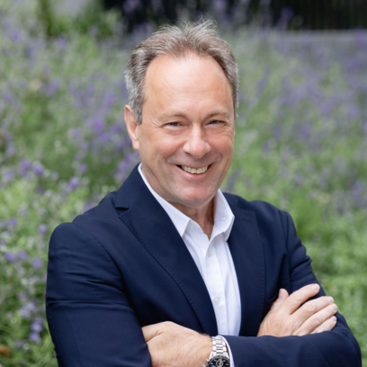Headshot of Luigi Di Sessa, a smiley man with blue eyes